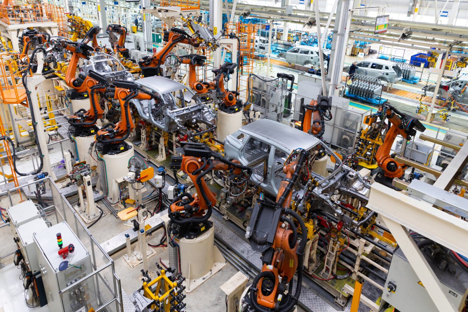 Car bodies are on assembly line. Factory for production of cars. Modern automotive industry. Electric car factory, conveyor